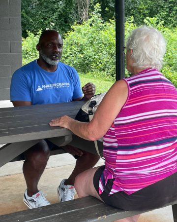 parks and recreation director speaks with a community member