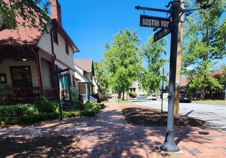 street in Biltmore village featuring shop, sidewak and street sign
