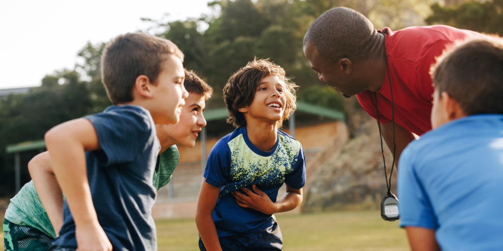 coach with young athletes