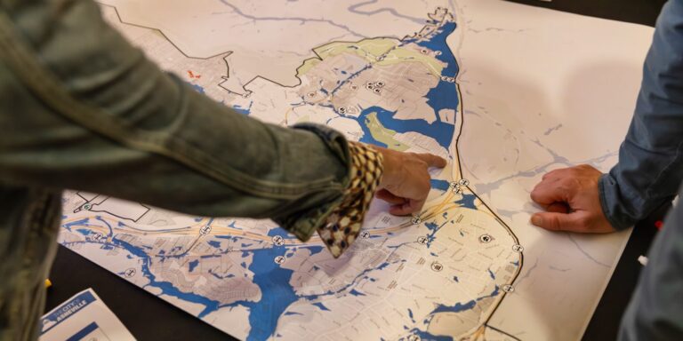 participants point to a map at a mapping session