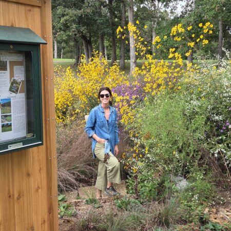 Mel Bowen among flowers